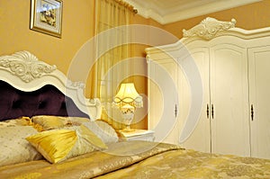 Yellow shining bedding and bedroom furniture