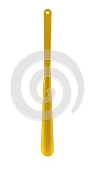 Yellow Shoehorn isolated on white background. It is long spoon