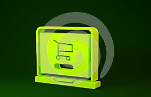 Yellow Shopping cart on screen laptop icon isolated on green background. Concept e-commerce, e-business, online business