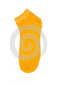 Yellow short sock on a white background, top view