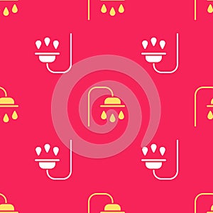 Yellow Shower head with water drops flowing icon isolated seamless pattern on red background. Vector Illustration