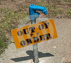 Yellow Sign on Out of Order Water spigot