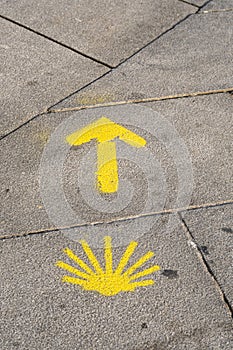 Yellow sign of the Camino de Santiago.