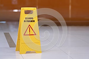 yellow sign of caution reserve cleaning on the wet floor