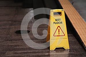 yellow sign of caution reserve cleaning on the wet floor