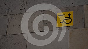 Yellow sign with a disabled person. Copyspace