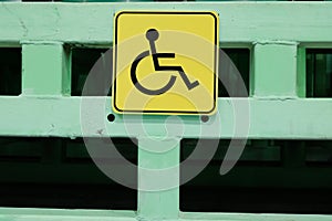 Yellow sign is a place for disabled people. Social sphere of life. Protection and assistance for people with disabilities