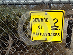 Yellow sign state beware of rattlesnakes