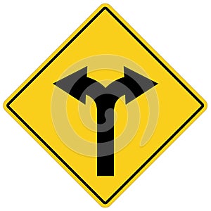 Yellow sign with two arrows. fork road yellow warning symbol.