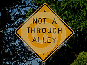 Yellow Signage `Not a Through Alley`