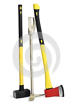 Yellow sledgehammer, axe and hooligan pinch-bar from fireman`s toolbox isolated