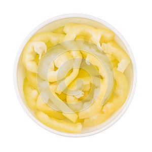 Yellow sliced pepper in a white bowl.