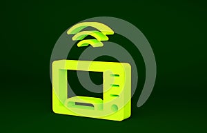 Yellow Smart microwave oven system icon isolated on green background. Home appliances icon. Internet of things concept