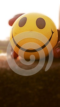 Yellow smiley ball closeup photo shoot