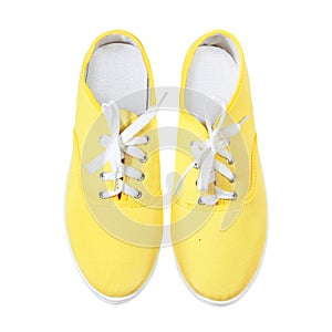 Yellow sneakers isolated on white background