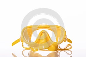Yellow snorkel eye mask isolated on white background. Swimming goggles dive mask