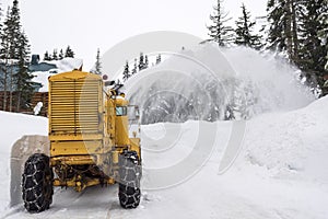 Yellow Snow Plow Clearing Mountain Road