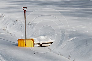 Yellow snow shovel snow