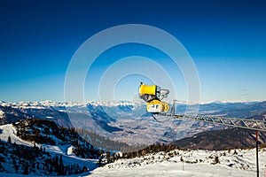 Yellow snowgun in Alps