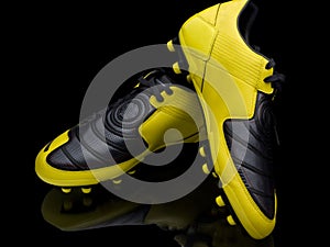 Yellow soccer footwear