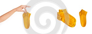 Yellow sock isolated on white background for design. Set of short warm socks yellow object for winter season. Woman hand holding