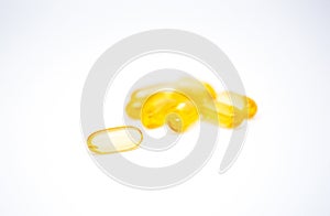 Yellow soft gelatin capsules contain of fish oil supplement isolated on white background