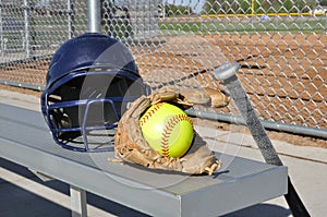 Yellow Softball, Helmet, Bat, and Glove