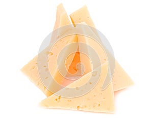 Yellow solid cheese pieces on the white background