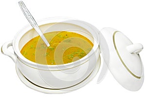 Yellow soup in tureen photo