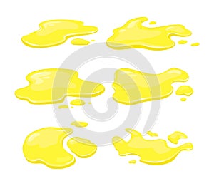 Yellow spills of juice, oil or honey on a white isolated background. Vector set of liquid puddles and drops of various