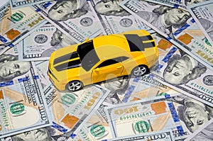 Yellow sport car on american dollars money background