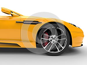 Yellow sports car - front wheel