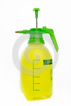 A yellow spray bottle isolated on a white background. close-up of spray bottle