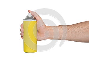 Yellow spray can for spraying in a male hand. No inscriptions. White background