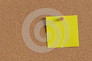 Yellow square note on corkboard. 3d photo