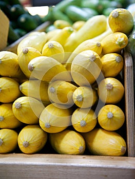 Yellow Squash in Wooden Grocery Store Bin