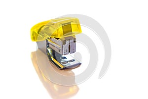 Yellow stapler isolated on white background