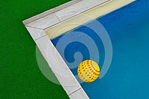 Yellow star ball floats in the pool