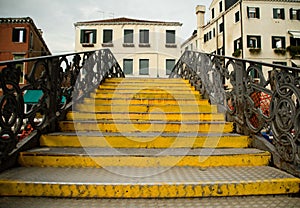 Yellow steps of a bridge near Venetian Ghetto