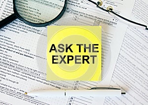 Yellow sticker with text Ask The Expert on financial docs