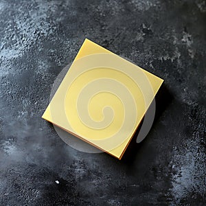 Yellow Sticky Note on Dark Surface