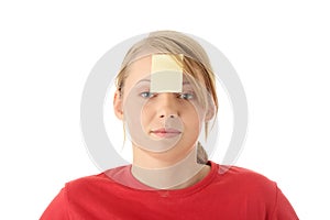 Yellow sticky note on forehead