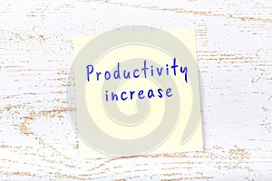 Yellow sticky note with handwritten text productivity increase