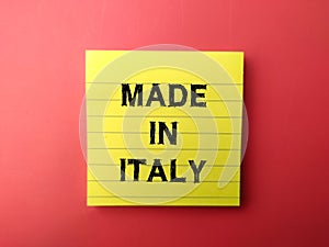 Yellow sticky note with the word MADE IN ITALY