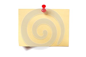 Yellow sticky post note with red pin isolated on white