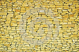 Yellow stone wall texture.