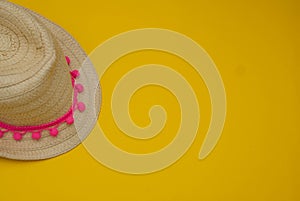 Yellow Straw Hat over Summer Yellow Background Holliday Relax Vacation photo