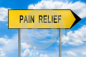 Yellow street concept pain relief sign photo
