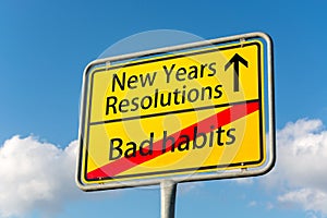 Yellow street sign with New Years resolutions ahead leaving bad