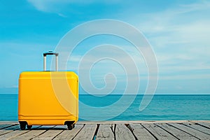 a yellow suitcase is sitting on a wooden pier near the ocean